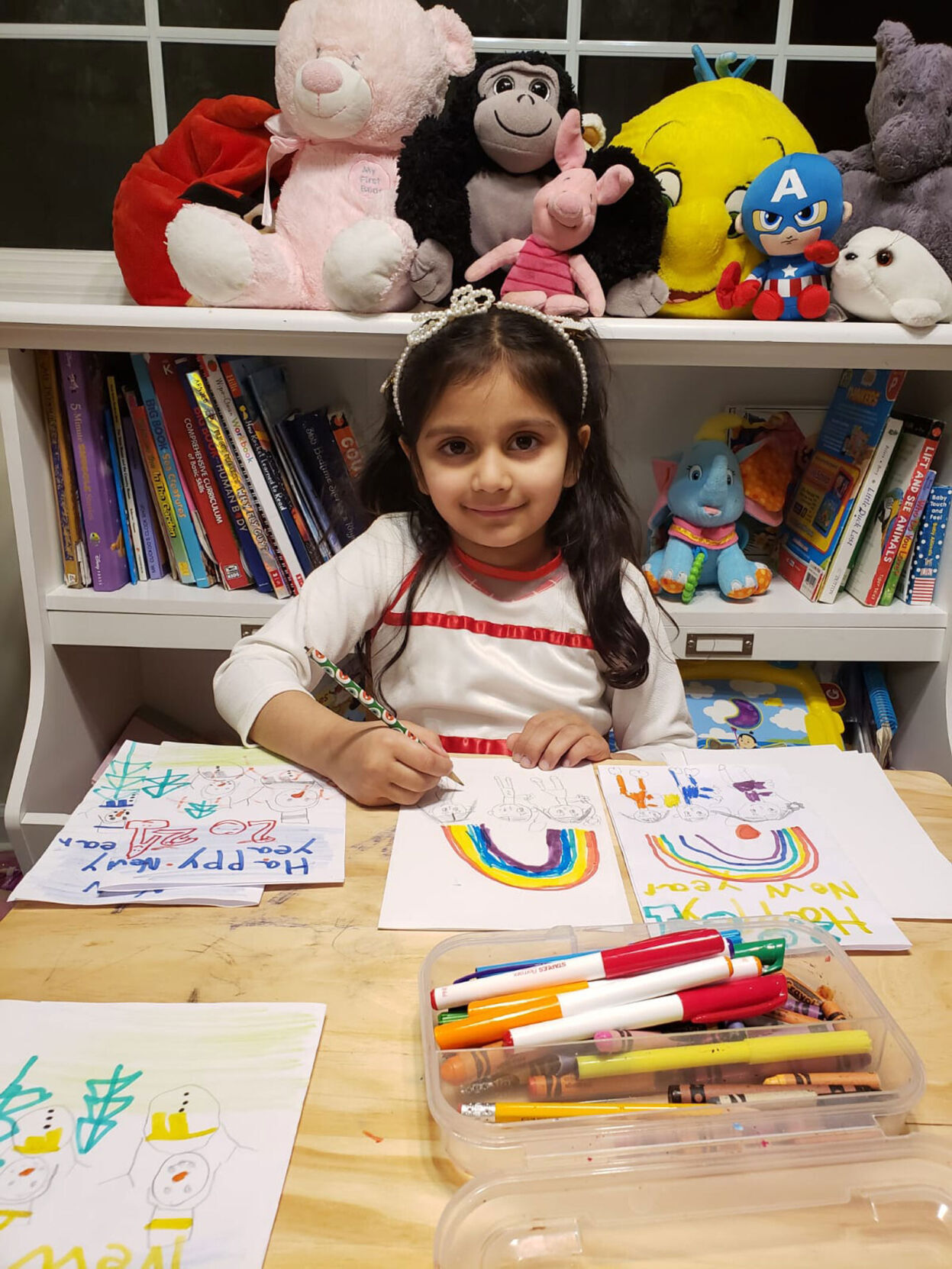 This kindergartner spent almost 2 weeks making 200 New Year's cards for seniors. Then she broke her piggy bank to buy them a gift